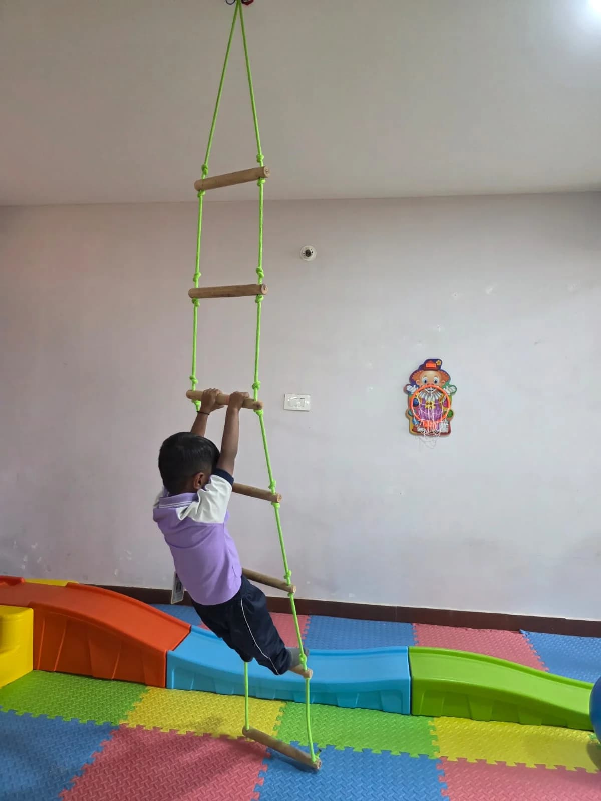 Child climbing the rope ladder