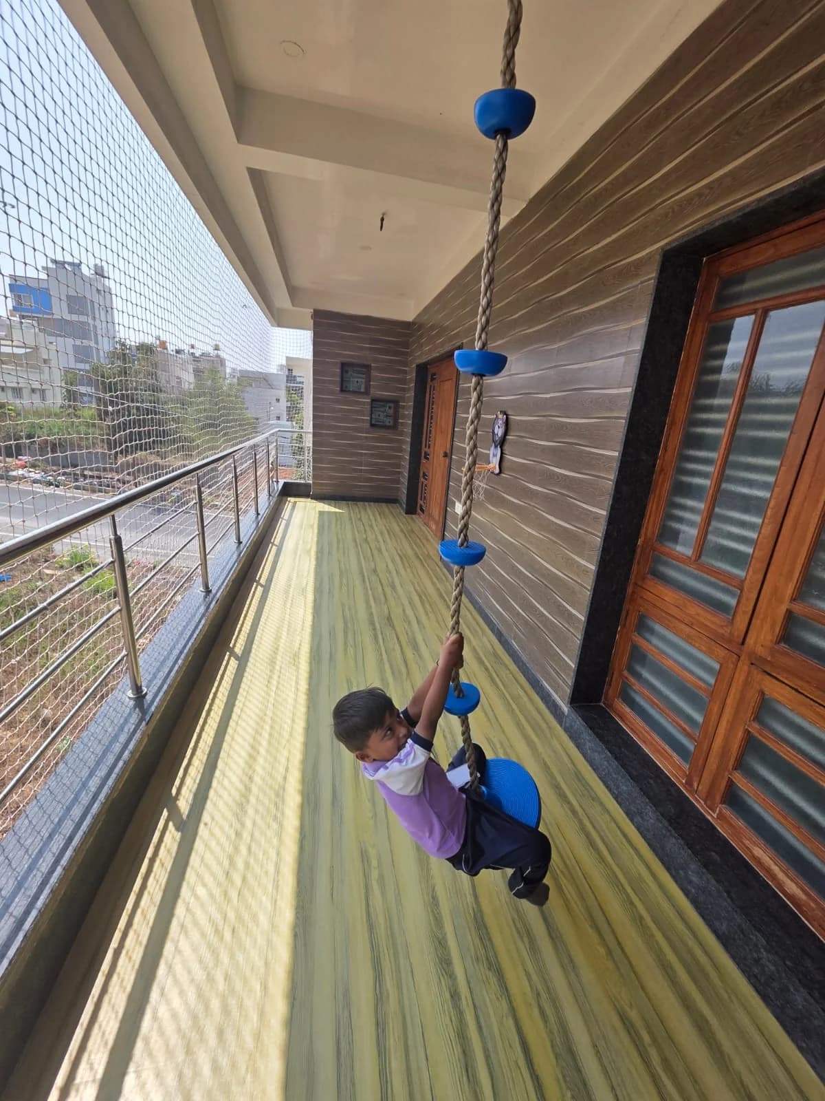 Child on rope swing at FlyHigh Pre School
