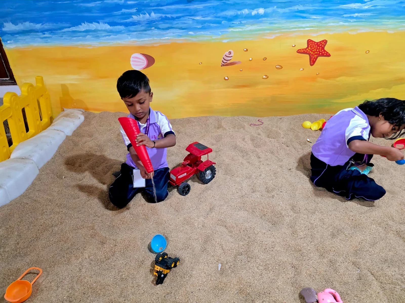 Children playing in the sand pit