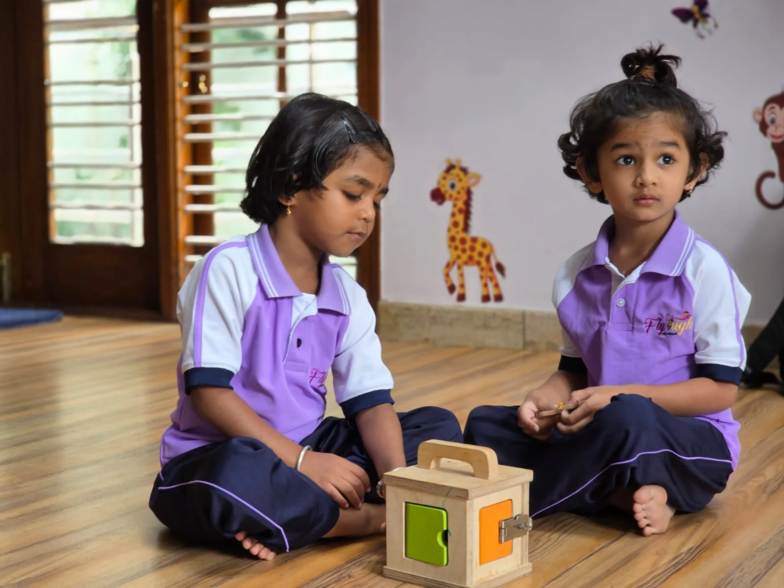 Children exploring wooden toys