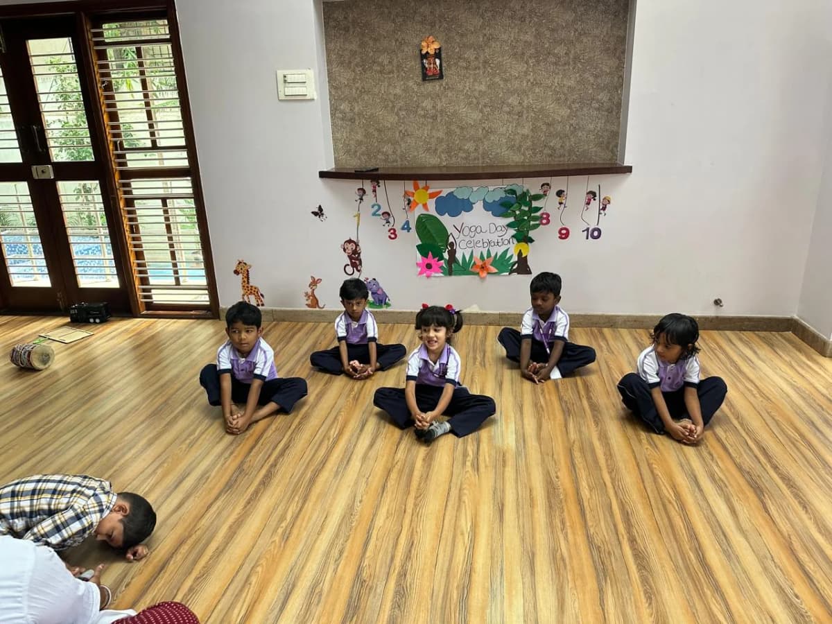 Children practising yoga at FlyHigh Pre School